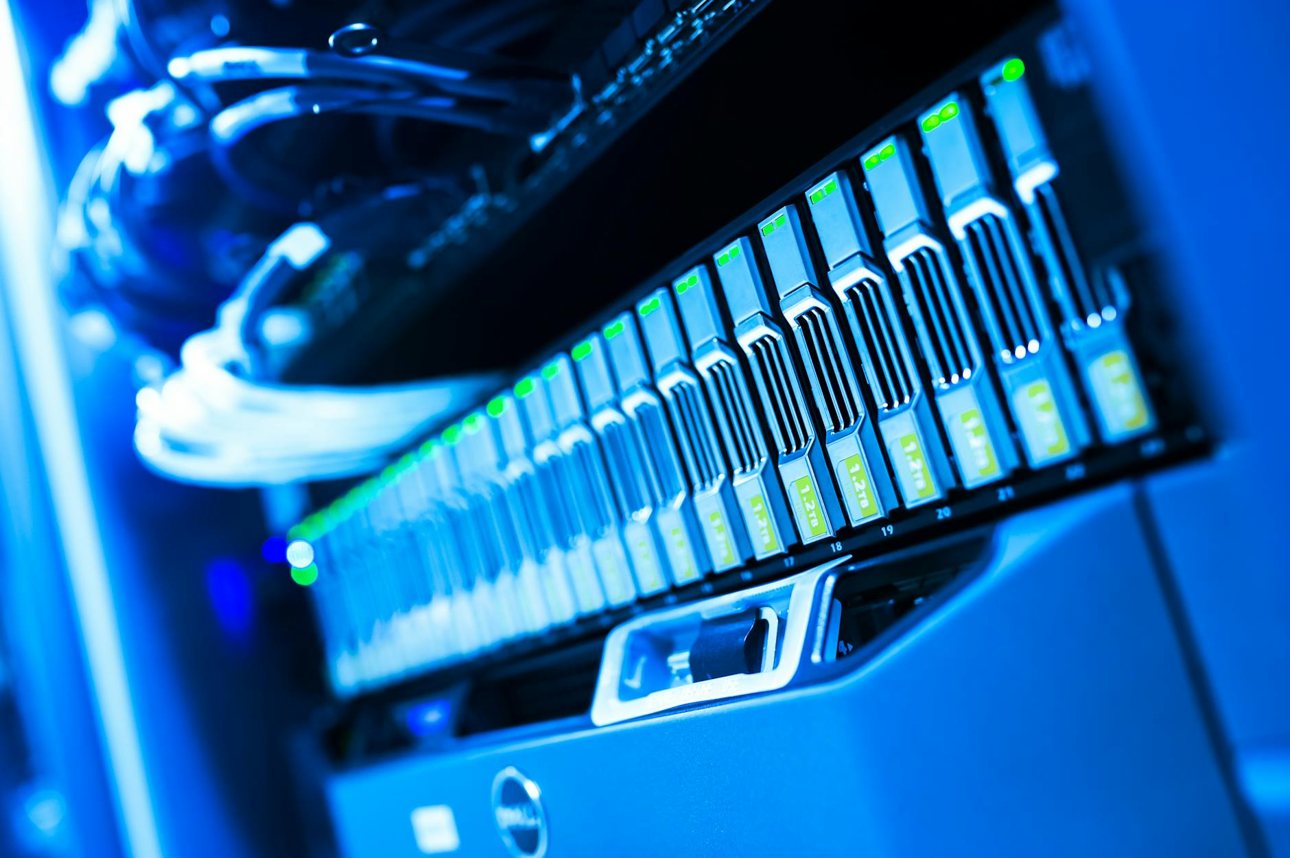 Close-up of blue-lit server hardware components representing database infrastructure and data protection