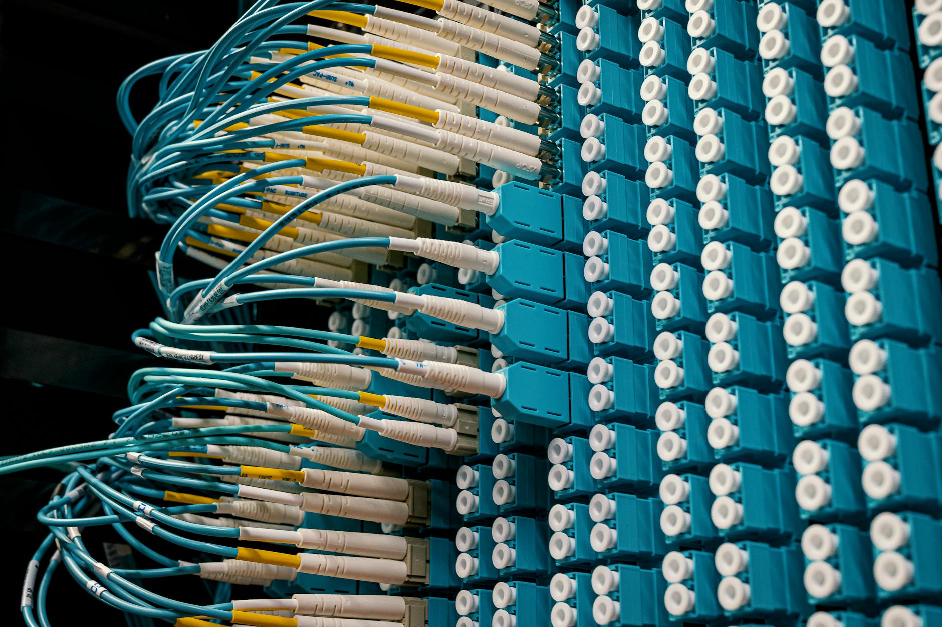 Network patch panel with colorful cables representing MCP server configuration connections across multiple AI tools